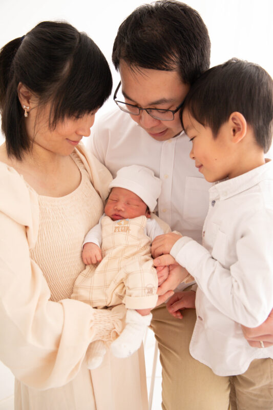 Family of four during a family photoshoot showing you what to wear for your photoshoot