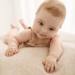 happy playful baby at beautiful photoshoot