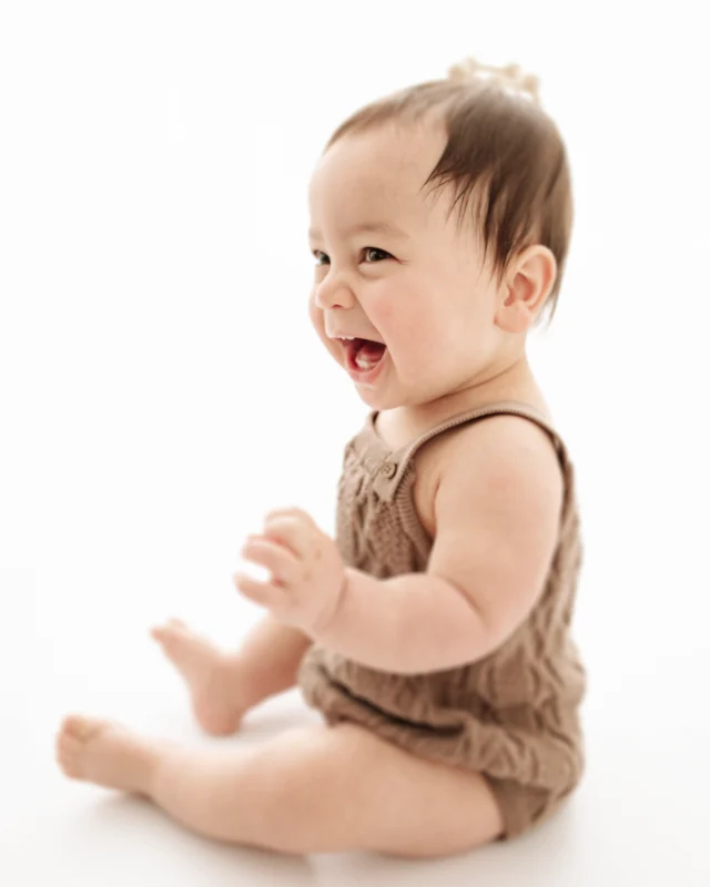 baby laughing at his photo session 