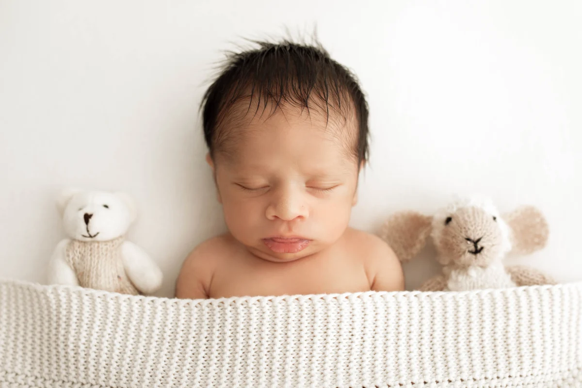cute newborn photos of baby at a photoshoot in Wimbledon