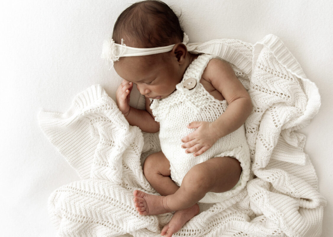 baby girl sleeping at newborn photoshoot - photgraphed by SW London newborn photographer 