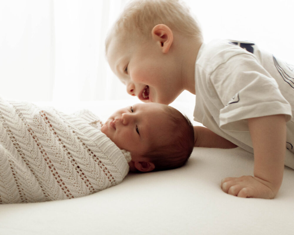london baby photoshoot with newborn brothernewborn and family photographer kingston