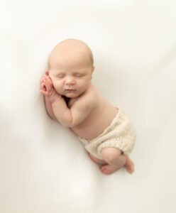 baby sleeping at newborn photoshoot in Kingston upon Thames